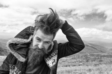 photo of bearded man in the mountain with copy space. bearded man outdoor. bearded man has beard. bearded man having moustache.