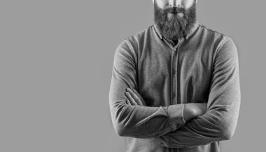 Confident man crop view with long beard. Unshaven face with red beard and mustache. Bearded and mustached Irish male studio isolated on grey, copy space.