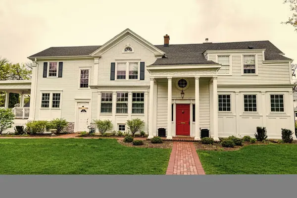 stock image real estate. architectural house in suburban america. house apartment in suburb. suburban neighborhood. cottage house in american neighborhood. suburban house property. Suburban streets.