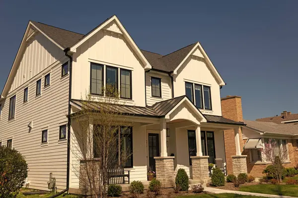 stock image residential building house outdoor. vintage cottage style home in residential neighborhood. neighborhood house architecture. modern cottage house. property in neighborhood. villa in america.