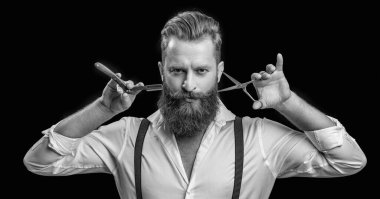 barber man isolated in black. barber man in studio. barber man with scissors and retro razor blade. photo of barber man on background.