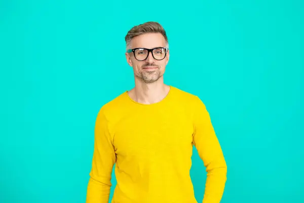 stock image Eyewear for man on blue. See good in eyeglasses. Mature man look in eyeglasses. Vision acuity and eyesight. Vision eyesight correction. Man look good in glasses. Trouble seeing. Corrected vision.