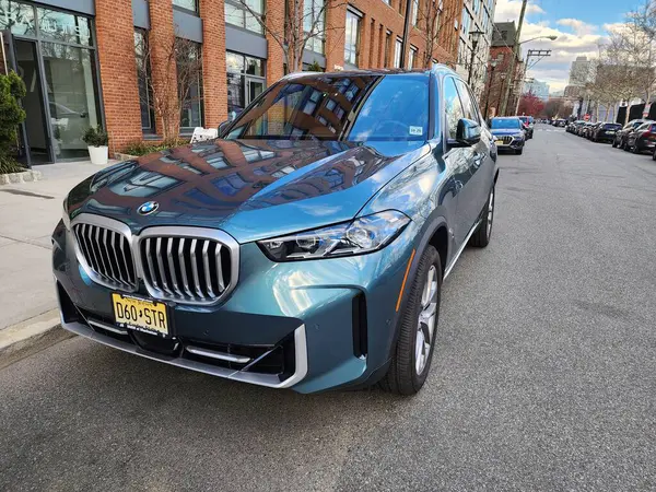 stock image New York City, USA - March 18, 2024: BMW X5 luxury car parked outdoor, angle view.