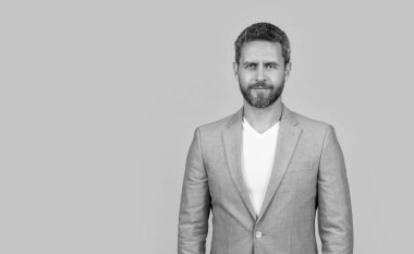 businessman in studio with copy space. photo of handsome businessman wear suit. businessman wearing formal jacket. caucasian businessman in jacket isolated on yellow background.