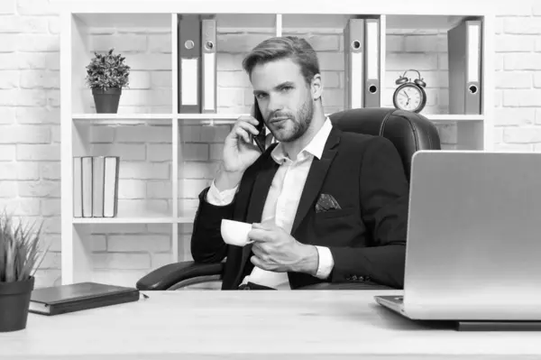 stock image businessman has smartphone talk in studio. businessman has phone talk on background. photo of businessman has phone talk. businessman has phone talk isolated on white.