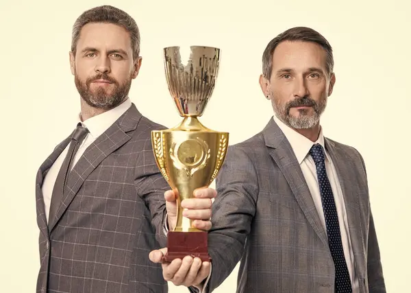 stock image champion. businessman rewarded for success. business success and reward. businessman in suit isolated on white. champion cup reward. successful leadership of business man. together we are stronger.