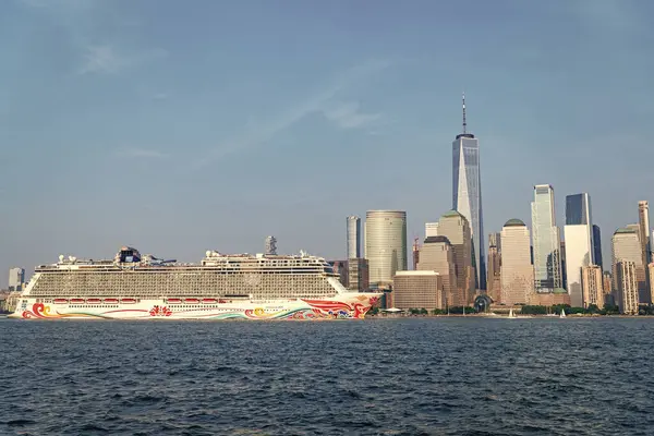 stock image New York, USA - June 13, 2023: Cruise ship Norwegian Joy Sailing next to Manhattan in New York. Skyline of New York Manhattan cruising on the Hudson River cruise liner NCL.