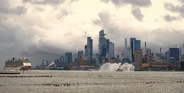 stock image New York, USA - July11, 2023: Cruise ship Norwegian Joy Sailing next to Manhattan in New York. Skyline of New York Manhattan cruising on the Hudson River cruise liner NCL.