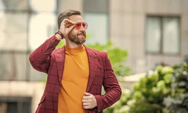 stock image charismatic guy in menswear in the street. guy in menswear outside. photo of guy in menswear of jacket. guy in menswear outdoor.