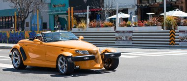 Long Beach, California USA - March 31, 2021: classic car of yellow Chrysler Plymouth Prowler. copy space. clipart
