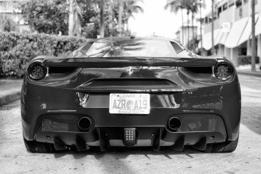 Miami Beach, Florida USA - April 18, 2021: red Ferrari 488 GTB, back view low angle.