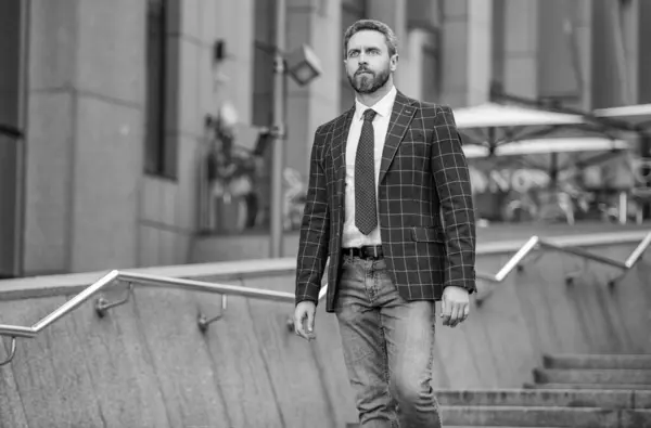 stock image photo of businessman with tie, advertisement. businessman outdoor. businessman on urban background. businessman wearing jacket in the street.