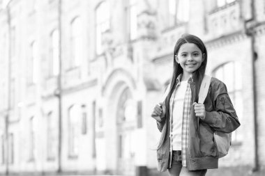 Happy teen girl back-to-school on September 1, copy space.