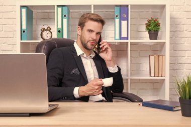 businessman has smartphone talk in studio. businessman has phone talk on background. photo of businessman has phone talk. businessman has phone talk isolated on white.