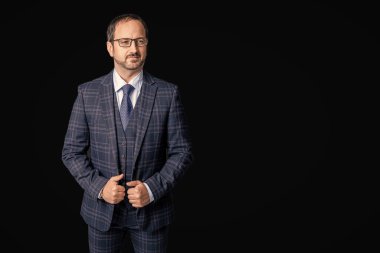 mature boss isolated on black background with copy space. boss in studio. boss wear jacket and tie. photo of boss in suit.