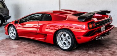 Miami Beach, Florida USA - April 15, 2021: red Lamborghini diablo, back corner view. luxury sport car.