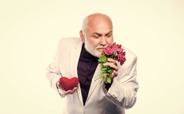 This is for you. Dating services for elderly people. Senior gentleman romantic. Man hold heart symbol of love. Gentleman concept. True gentleman. Handsome bearded man wear tuxedo. Romance and dating.