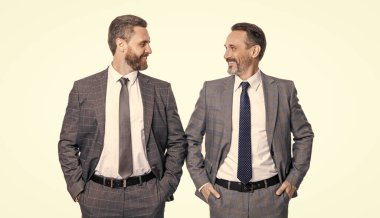 glad businessmen leadership concept. leadership of two businessmen in studio. image of leadership of businessmen wear suit. leadership of two businessmen isolated on white background.