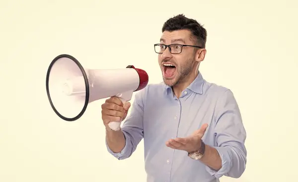 stock image amazed shouting man announcer with megaphone. photo of man announcer with megaphone. man announcer with megaphone isolated on white background. man announcer with megaphone in studio.