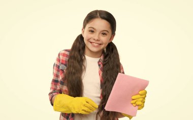 duster helpful for wiping dust. happy kid use duster and cleaning gloves. small girl yellow rubber protective gloves ready to clean. Household duties. Dish wash gloves. Yellow glove for cleaning.