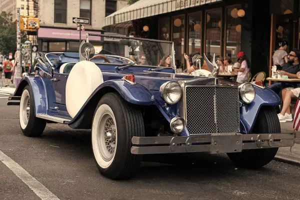 stock image New York City, USA - June 30, 2023: Excalibur Series III phaeton car front side view parked.