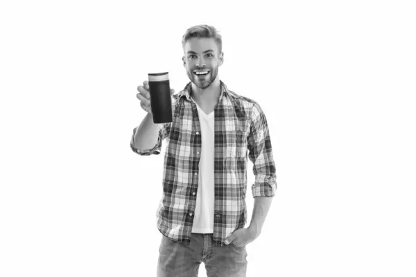 stock image positive man with aftershave cosmetics in studio. photo of man with aftershave cosmetics. man with aftershave cosmetics isolated on white. man with aftershave cosmetics on background.