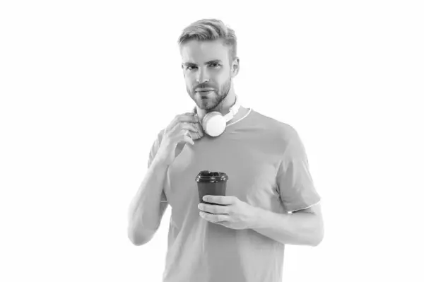 stock image millennial guy with coffee isolated on white, lifestyle. millennial guy with coffee on background. millennial guy with coffee in studio. photo of millennial guy with coffee.