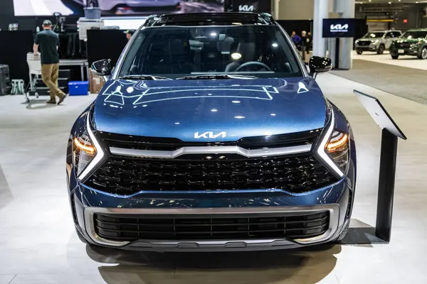 Stock image New York City, USA - March 27, 2024: 2023 Kia Sportage Hybrid blue car at New York International Auto Show, front view.