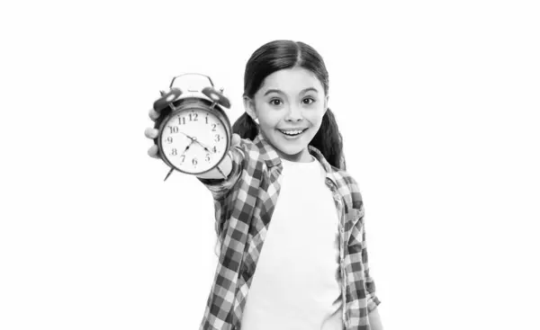 stock image teen girl with alarm time isolated on white, selective focus. teen girl with alarm time in studio. teen girl with alarm time on background. photo of teen girl with alarm time clock.