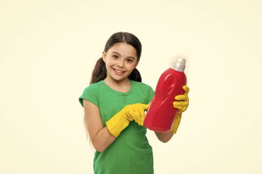 cheerful girl with laundry detergent in studio. girl with laundry detergent on background. photo of girl with laundry detergent. girl with laundry detergent isolated on white.
