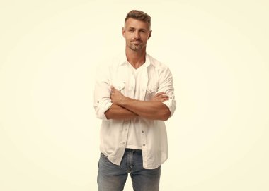 confident mature grizzled man isolated on white background. grizzled man in white shirt. grizzled man style. studio shot of grizzled man.