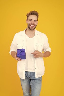 cheerful man with present isolated on white. man with present in studio. man with present on background. photo of man with present box.
