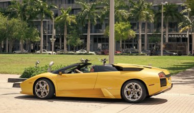 Miami Beach, Florida USA - April 15, 2021: yellow lamborghini diablo v12 6.2L, side view. convertible supercar.
