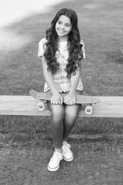 happy teen girl skater with skateboard outdoor. girl with penny board. hipster girl with longboard skate.