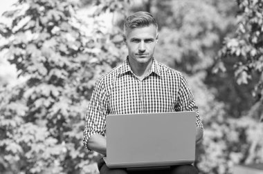 mature man working on laptop. man freelancer outdoor. business man with pc.