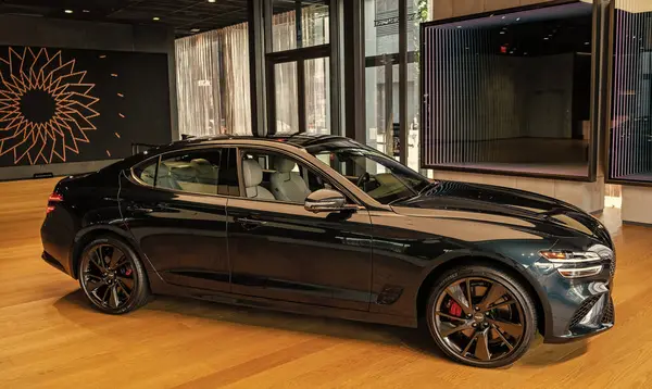 stock image New York City, USA - August 06, 2023: Genesis G80 black Hyundai electric car passenger side view parked at an exhibition hall.