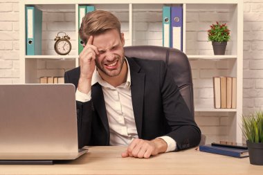 stressed businessman has headache on background. photo of stressed businessman has headache. stressed businessman has headache isolated on white. stressed businessman has headache in office