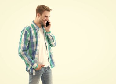 man having phone call wearing checkered shirt, copy space. photo of man has phone call communication. man has phone call isolated on white background. casual man answer phone call in studio.