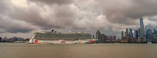 stock image New York, USA - July11, 2023: Cruise ship Norwegian Joy Sailing next to Manhattan in New York. Skyline of New York Manhattan cruising on the Hudson River cruise liner NCL.