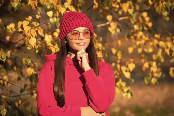 stock image outfit for the fall style. stylish girl in autumn. teen girl has trendy sunglasses. autumn fashion girl. trendy and stylish tween girl outdoor. fall fashion style for teen. Fall foliage.