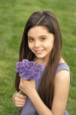 happy teen girl with flowers. pretty girl with spring bouquet. cute girl portrait.