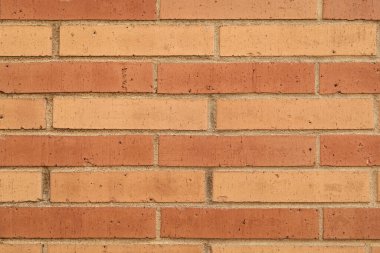 Kalıplaşmış kahverengi fon. Duvar dokusu arka planı. Tuğla duvar yapısı. Tuğla ustalığı. Malzeme konsepti. Tuğla duvarın yüzeyi. Tuğla bağlar.