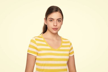 young girl in summer striped tshirt isolated on white background.