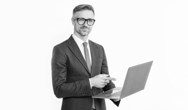 cheerful mature businessman working on laptop isolated on white background.
