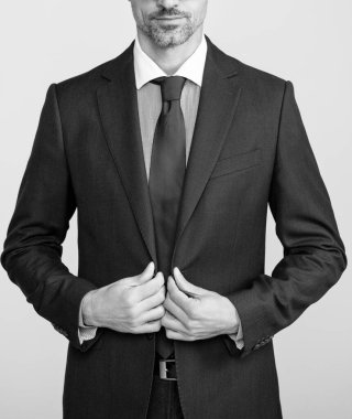 confident mature leader in formal business suit and spectacles.