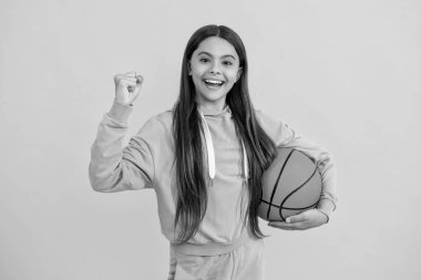 Childhood memories of playing basketball. teen girl childhood with basketball. teen girl play with ball. basketball in childhood. Learning basketball at teen girl childhood. Teen sports enthusiasts. clipart