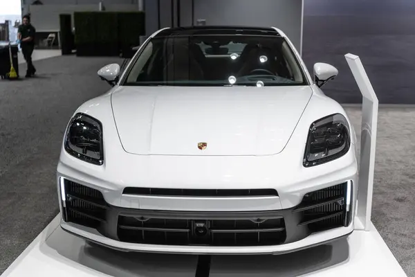 stock image New York City, USA - March 27, 2024: Porsche Panamera sport sedan car white color at New York International Auto Show, front view.