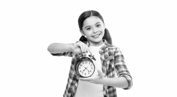 stock image teen girl holding alarm time on background. photo of teen girl with alarm time clock. teen girl with alarm time isolated on white. teen girl with alarm time in studio.