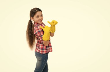 well done. Cleaning supplies advertisement. small girl cleaning in rubber gloves. kid clean house in latex gloves. Yellow gloves for cleaning the house. housework concept. time for washing.