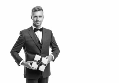 smiling mature man in suit with birthday present isolated on white.